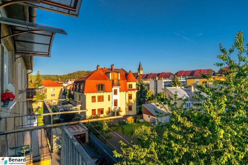 View from the balcony of a 2-room apartment on Fučíkova Street in Bardejov with a view of the rooftops.