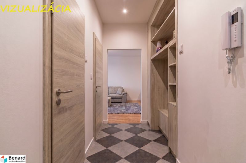 A hallway with checkerboard flooring, built-in shelves, and a view into the living room in a 2-room apartment.