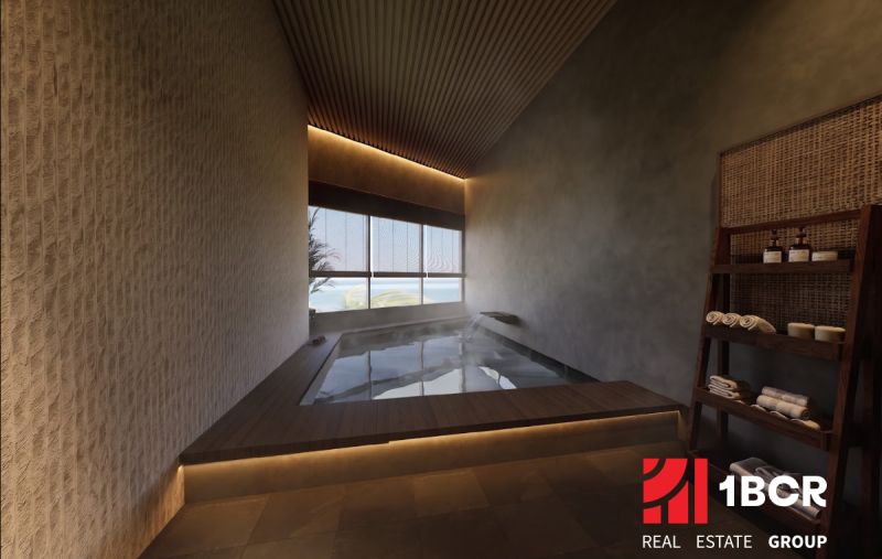 Bathroom with a whirlpool, wooden decor flooring, shelf with towels and cosmetics.