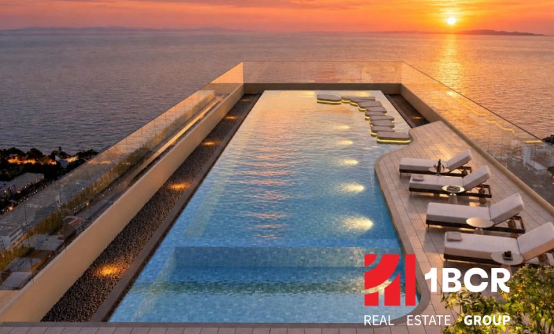 Rooftop pool with a view of the coastline as part of the apartment construction in Pattaya.