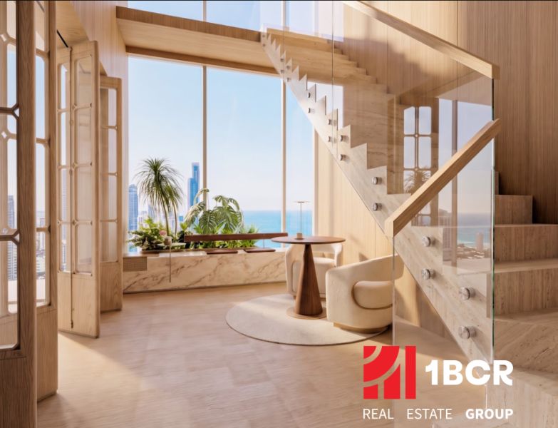 Interior with wood-patterned flooring and staircase, ocean view. Apartment construction.