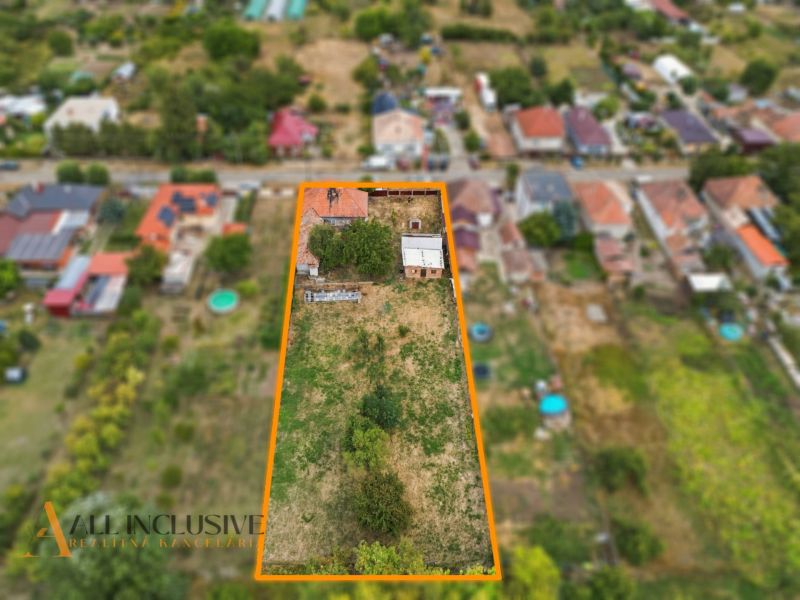 A family house in Bátorove Kosihy surrounded by a garden and neighboring properties.