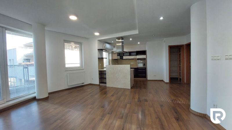 Interior of a 2-room apartment with a kitchen and flooring with a wood decor.