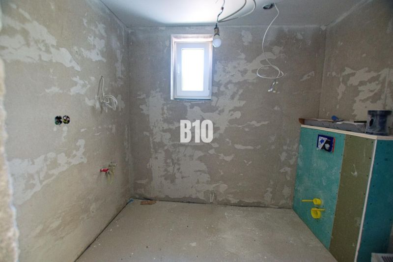 There are conduits on the wall, the room is under construction, it connects the family house.