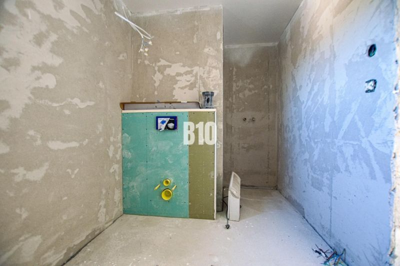An unfinished bathroom in a family house, ready for the installation of equipment.