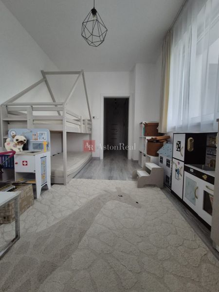 A children's room with a bunk bed and decorative lighting in a 3-room apartment.