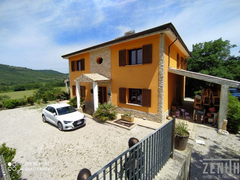 Villa on G. Puccini Street in Perugia with countryside in the background.