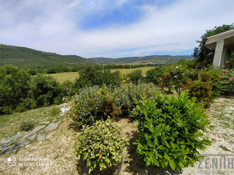 Garden at the Villa on G. Puccini Street in Perugia with greenery and a hilly view.