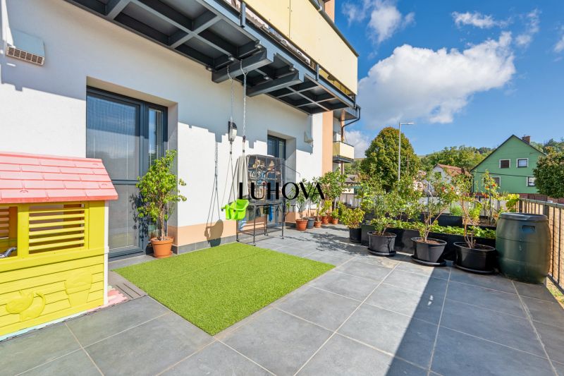 Exterior of a 3-room apartment on the street in Mikušovce with a garden nook.