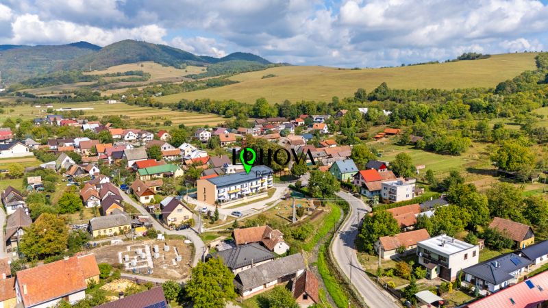 Aerial view of the picturesque village in Mikušovce with surrounding nature and 3-room apartments.