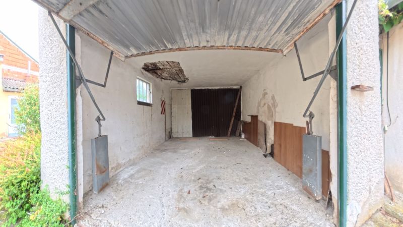 A garage with a worn-out ceiling in a family house on Jesenského Street in Levice.