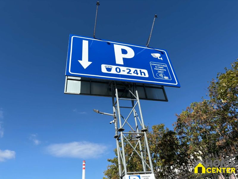 Parking markings and payment options in Komárno, Offices. Security cameras present.