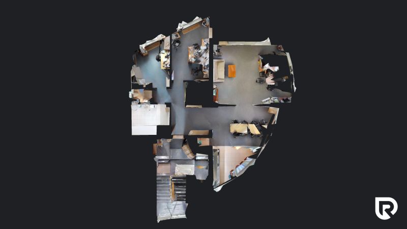 3D floor plan of offices with wood-patterned flooring and office furniture.