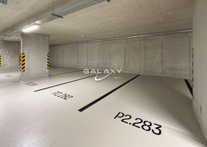 Garages with a light background and numbered parking spaces.