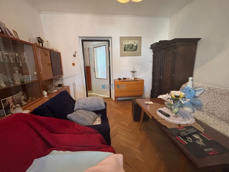 Living room with furniture in a family house and a wooden decor floor.