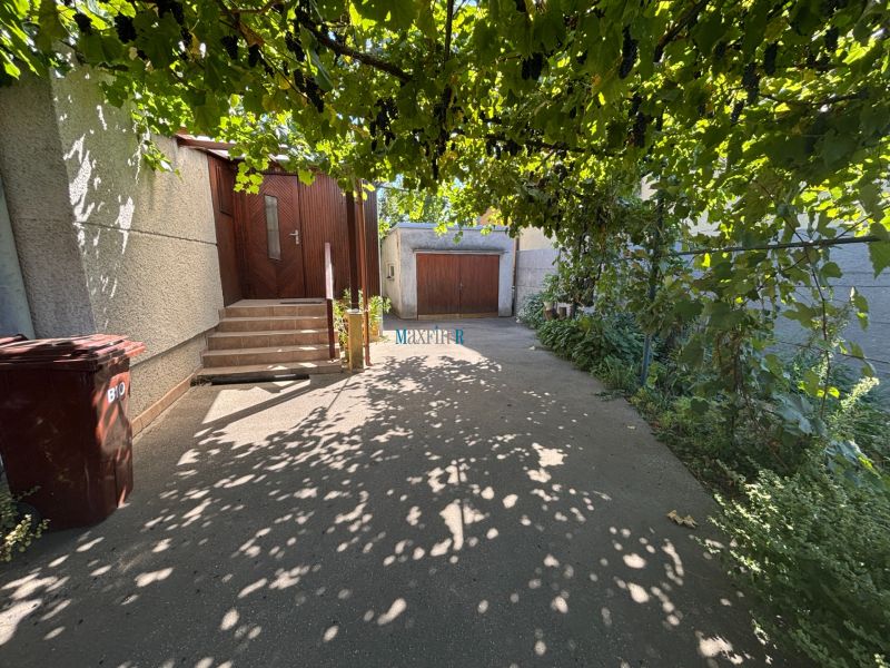 A family house on Gorazdova Street in Nitra, a shady terrace with grapevines.