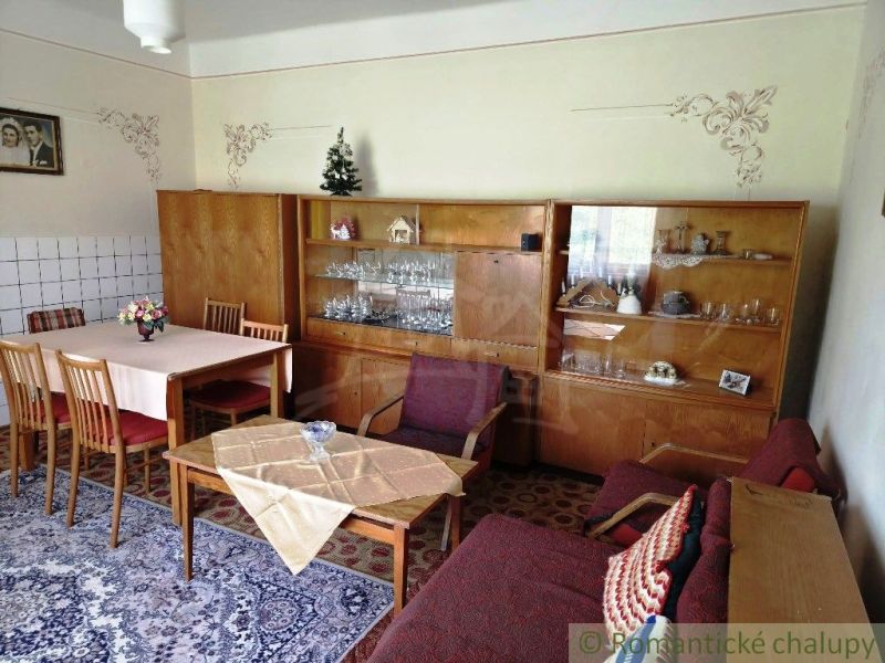 Living room in a family house with wooden furniture and decorations.