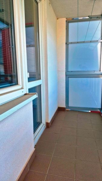 Balcony with tiles and matte glass railings, Studio apartment in Nové Mesto nad Váhom.