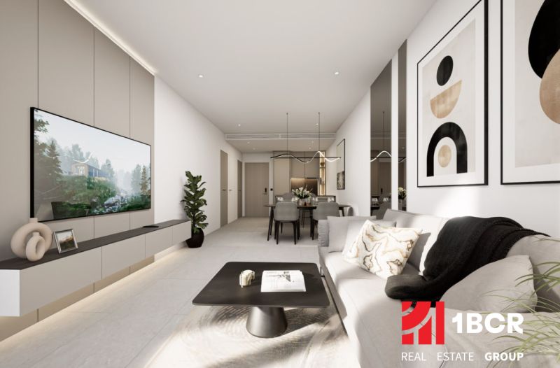 Bright living room in a two-room apartment with a wooden decor floor.