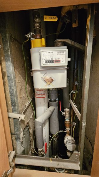 A measuring device for measuring gas consumption in the space of a one-room apartment.