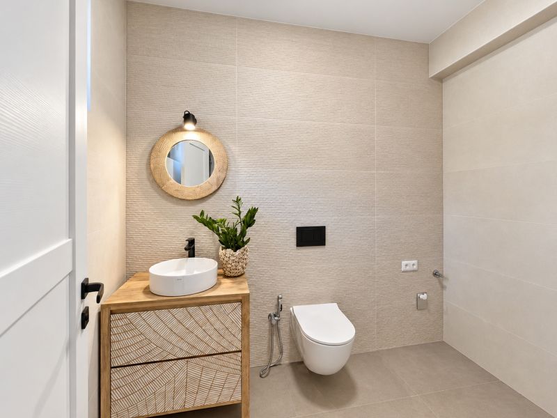 A bathroom with wooden decor, a sink, and a mirror in a family house.