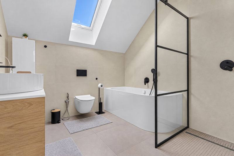 A stylish bathroom with a bathtub, shower, and skylight in a family house.