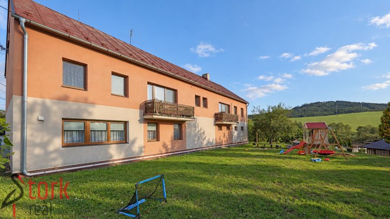 Apartment building on Bystrická Street in Rajec with a garden and a children's playground.