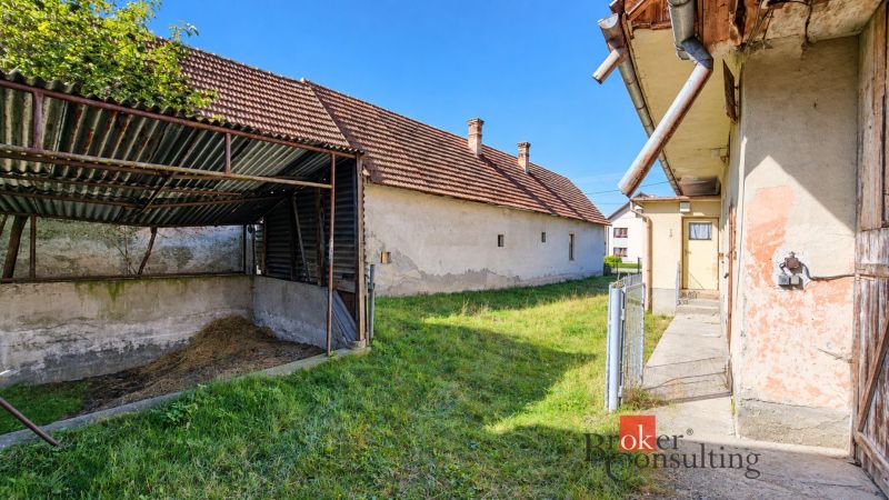 A family house in Žiar with a shelter and a grassy garden.
