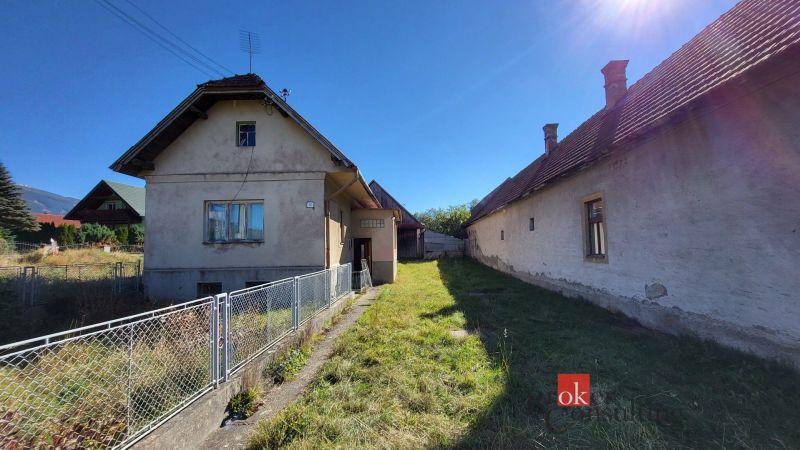 A family house in Žiar with a garden and two buildings, on the sunny side.