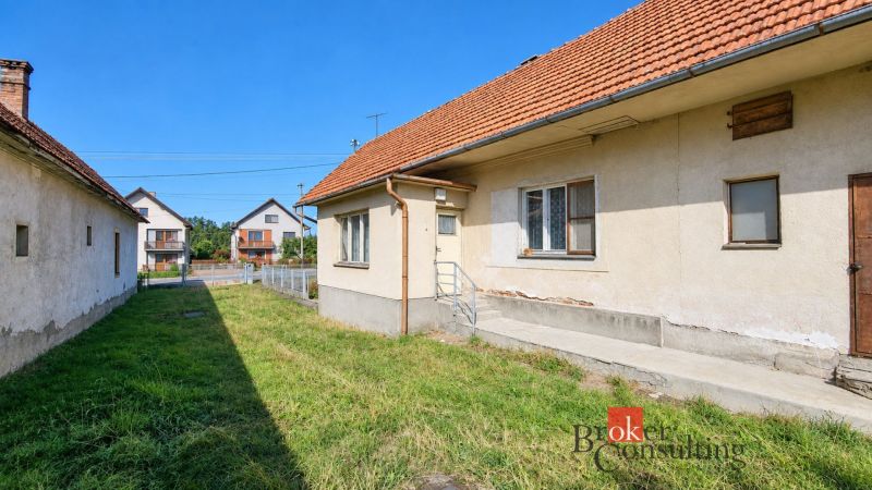 A family house in Žiar with a sloped roof and a grassy yard.