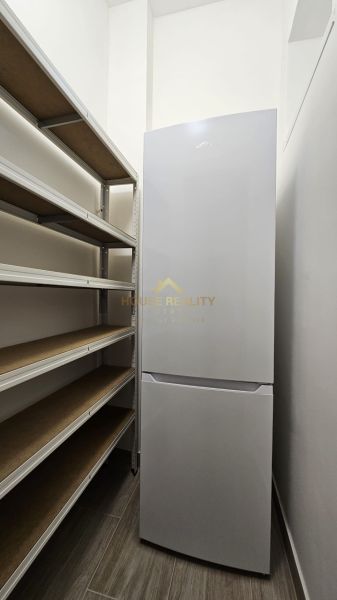 Shelf and refrigerator in the storage space of a 2-room apartment.