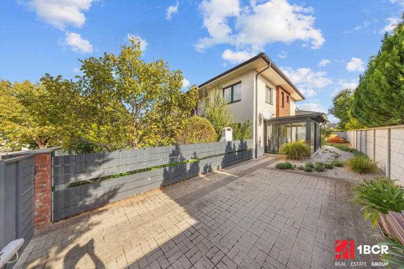 Two-story house on Mihály Marczell Street in Dunajská Streda with a landscaped garden.