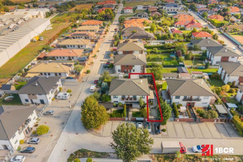 Mihály Marczell Street in Dunajská Streda with terraced houses and a marked 3-room apartment.