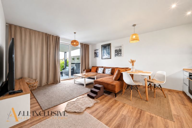 Living room in a family house with a corner sofa and decorative accessories.