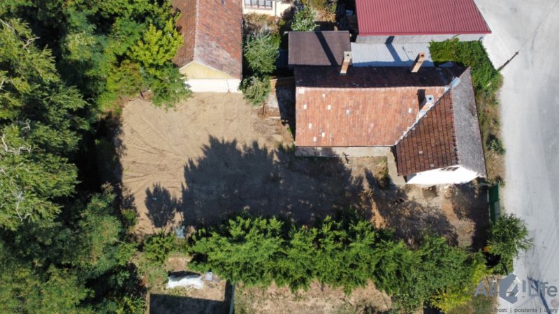 A family house on St. Florian Square in Krakovany with an adjacent empty plot.