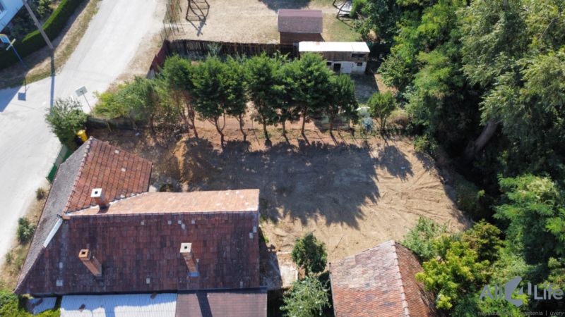 A family house on St. Florian Square in Krakovany with a large yard and greenery.