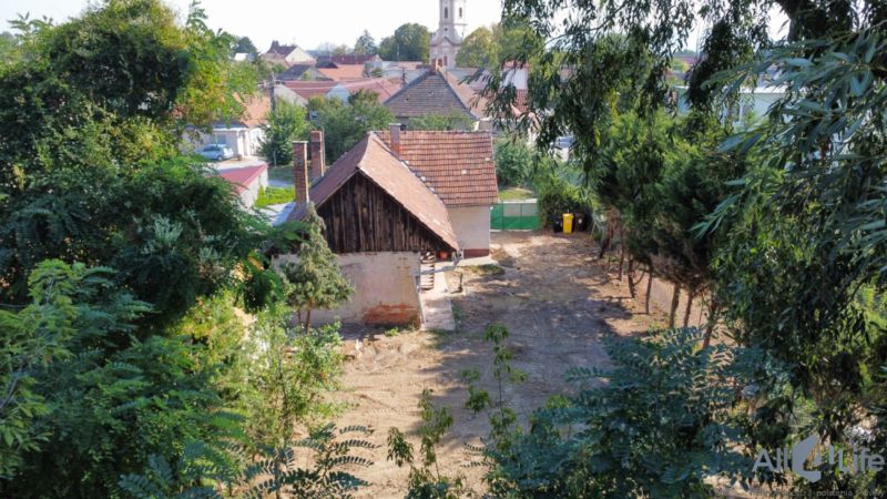 A family house on St. Florian Square in Krakovany with surrounding greenery.