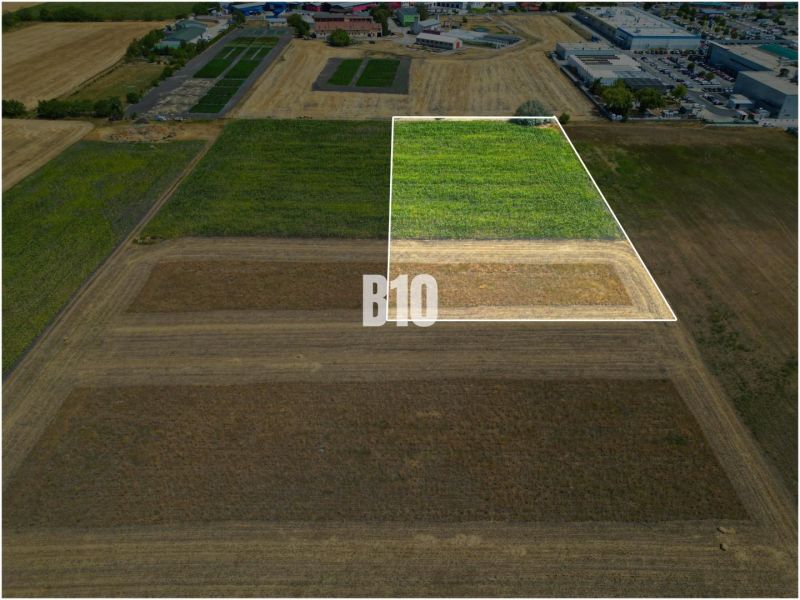 Aerial view of properties - housing in Nové Zámky surrounded by agricultural landscape.