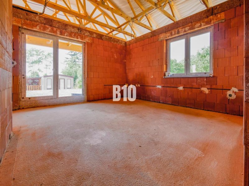 An unfinished room in a family house with a view outside in Čeľadice.