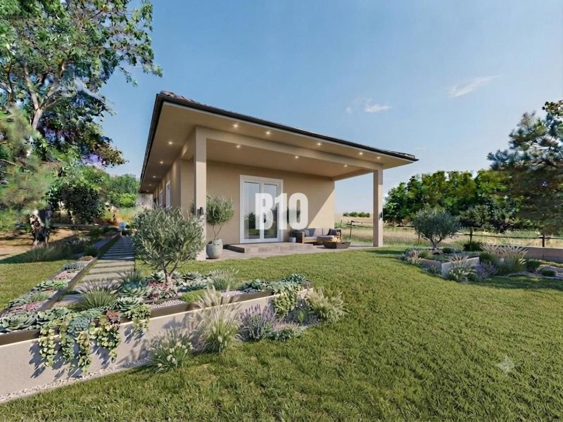 A family house in Čeľadice surrounded by a garden with a terrace and greenery.