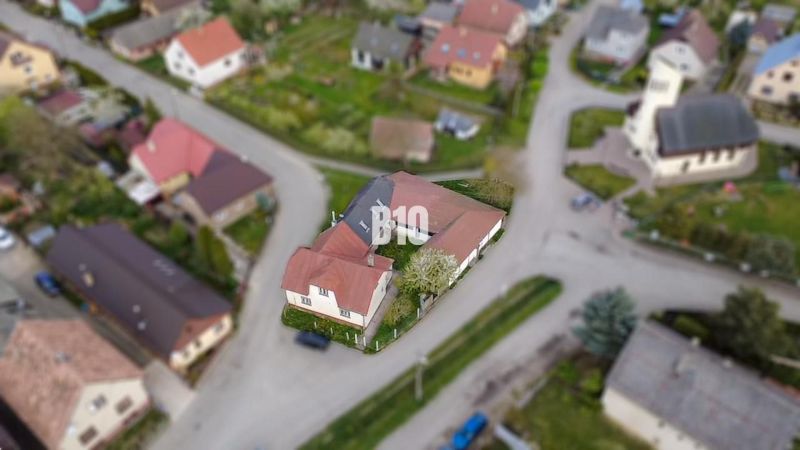 A family house in Púchov with a sloped roof and a garden in a quiet location.