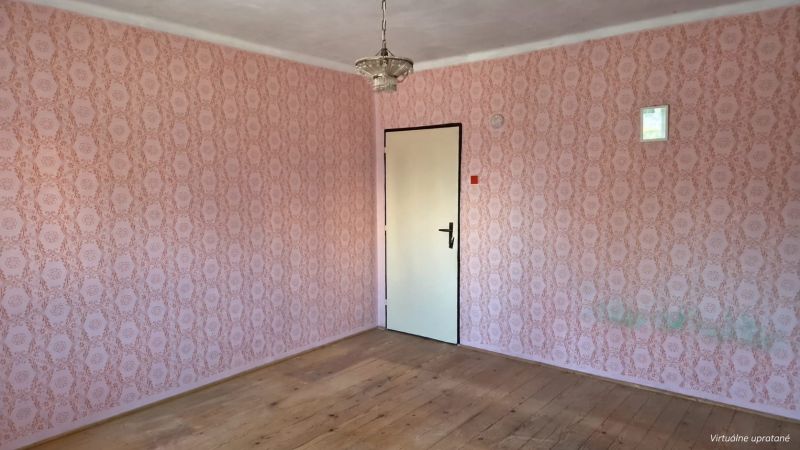An interior in a family house with wallpaper and flooring with a wood design.
