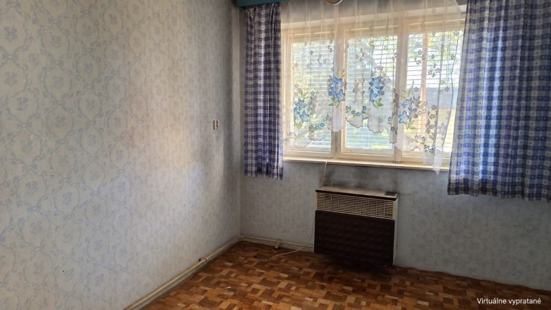 Interior of a family house with wallpapers, curtains, and a wooden decor floor.