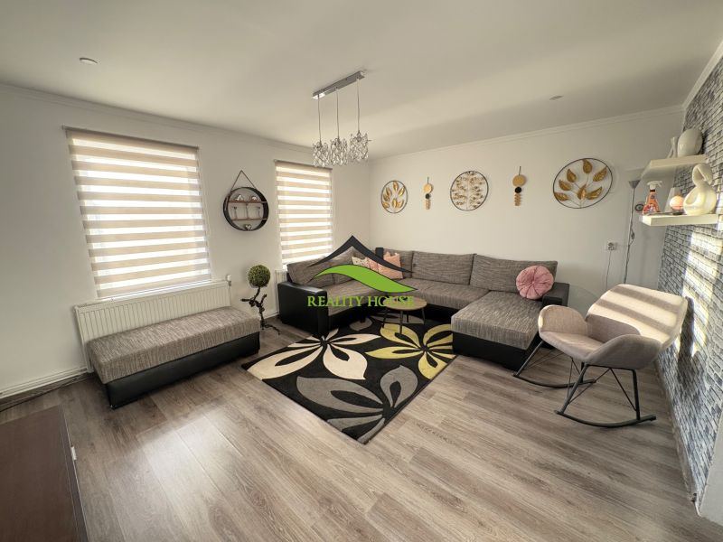 Living room of a family house with wall and floor decor in wood design.