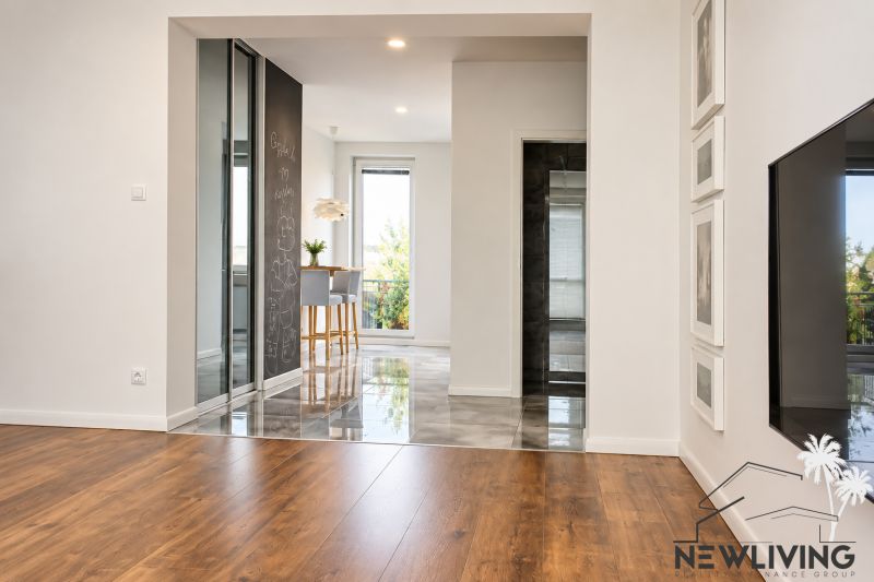 Living area in a 3-room apartment with wood-patterned flooring and a view.