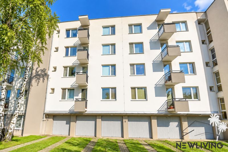 Apartment complex on Vážska Street in Piešťany with balconies and garage doors.