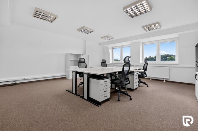 Offices with workstations, chairs, shelves, and windows, floor with wooden decor.