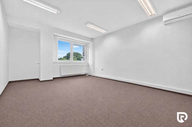 Offices with a large window and white walls, ideally on Brnianska Street in Trenčín.