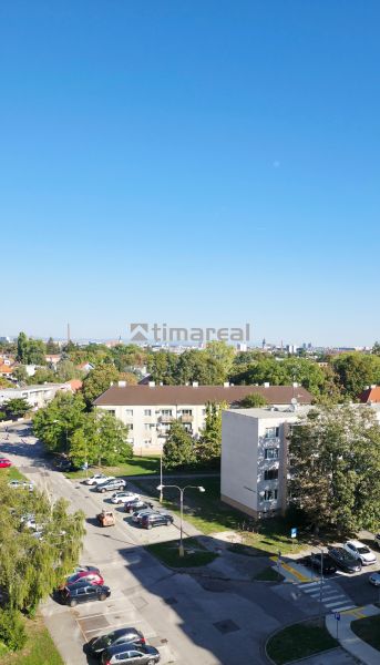 View of a residential area and greenery, Trnava, from a height, suitable for a 3-room apartment.