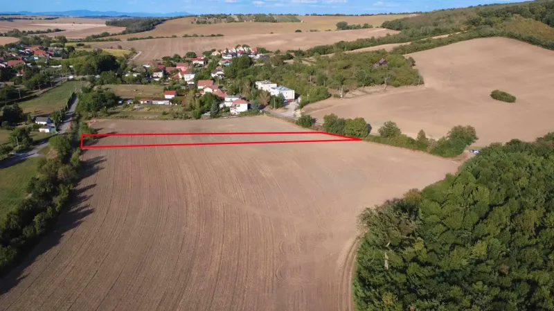 Agricultural and forest land in Podhájska, with views of the surrounding fields and greenery.